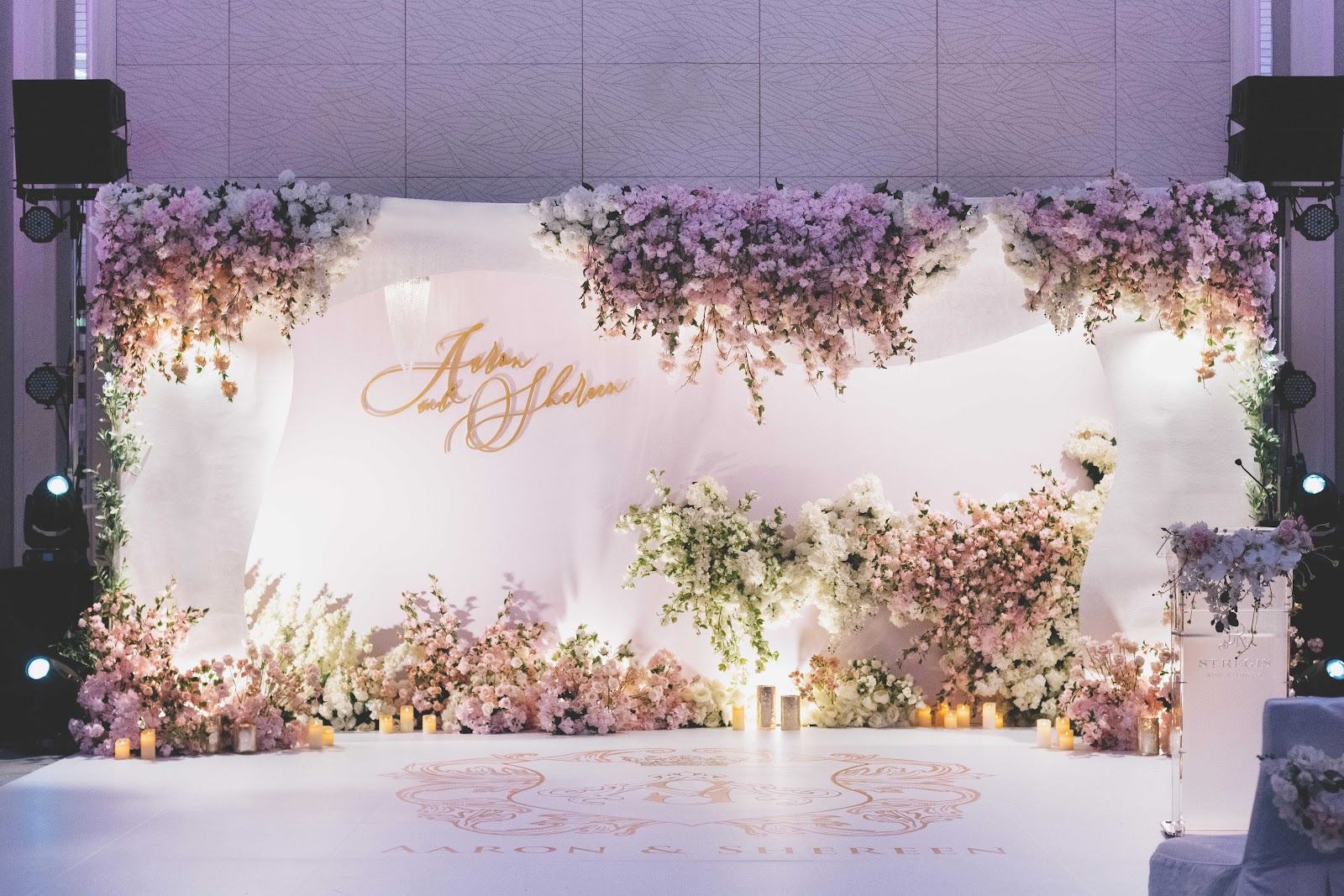 Wedding stage backdrop with pastel florals